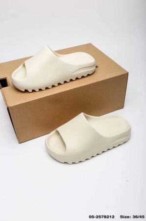 White closed Adidas Yeezy 451 Slide in sandals