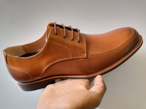 Brown leather laced rubber sole official shoes