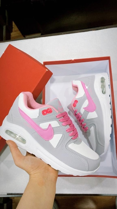 quality ladies nike sneakers with pink blending.